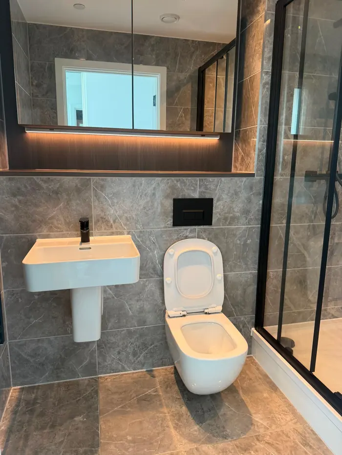 Marble-effect shower room cleaned for the landlord
