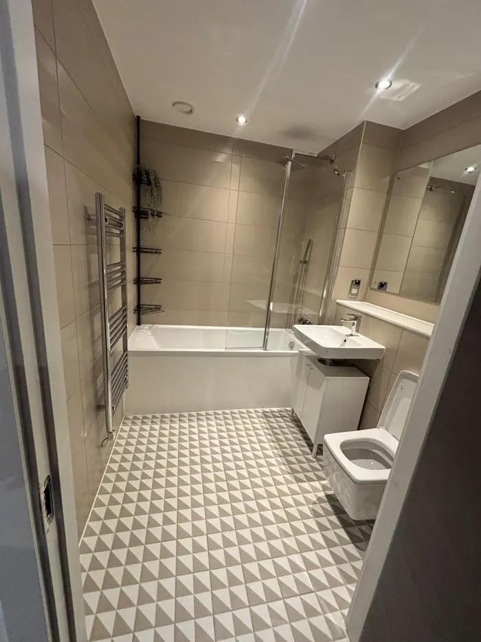 Bathroom with patterned floor tiles cleaned for move-out