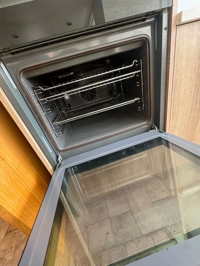 Oven door open showing a clean interior