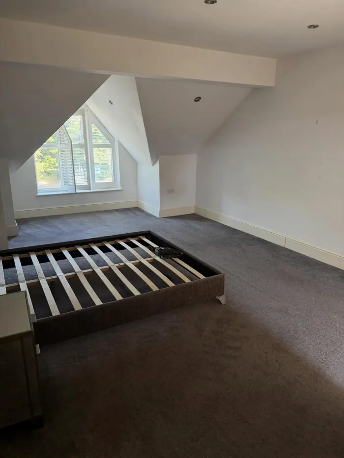Empty loft bedroom with carpet cleaned for new tenants