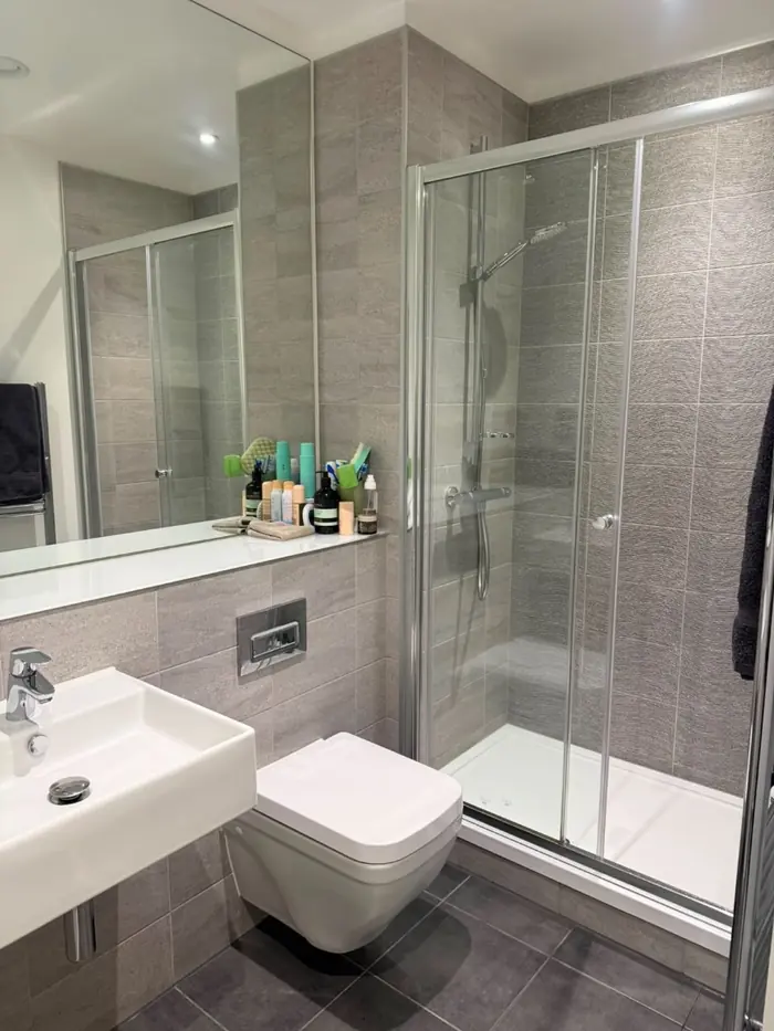 Shower room with sparkling glass and basin